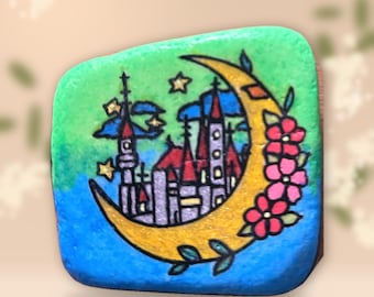 Hand Painted Stone Golden Moon with Fairytale Castle and Flowers – Dreamy Night Art, Nursery Decor, Unique Rock Art