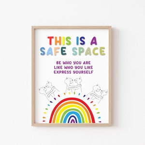 May include: A colorful poster with the text "This is a Safe Space" and the words "Be who you are, Like who you like, Express yourself". The poster features a rainbow and three cartoon figures hugging.