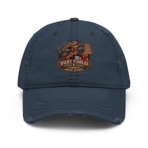 May include: A navy blue distressed baseball cap featuring a graphic print of a person in a hat holding a mug, accompanied by a deer and a dog. The text reads Dicky Fiddles Outdoor Marvels Est. 2020, along with smaller text listing outdoor activities.