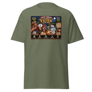 May include: An olive green t-shirt featuring a graphic print titled Dicky Fiddles Campfire Stories Tater The Mind Reading Coon Dog. The design includes a man in a hat, a dog wearing a turban, a campfire, a raccoon, and various text bubbles.