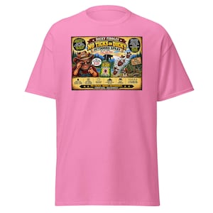 May include: A bright pink t-shirt featuring a rectangular graphic print. The design displays a cartoon character in a hat, a bottle of Dicky Fiddles No Ticks On Dicky Outdoors Spray, and various text elements including "No Ticks On Dicky" and "Get Out There, Stay Tick Free!"