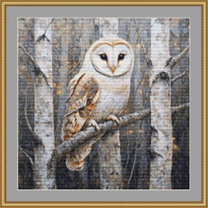 May include: A cross-stitch embroidery pattern featuring a barn owl with white and brown feathers perched on a tree branch. The background depicts a dense forest of birch trees with vertical white and grey bark patterns and small golden light accents.
