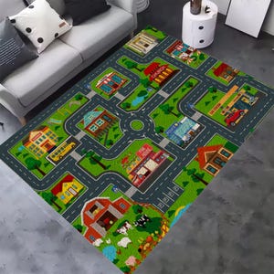 May include: A rectangular area rug featuring a colorful city map design with gray roads, green grass, and various buildings including a school, church, fire house, police station, and gas station, along with a farm scene containing cows and sheep.