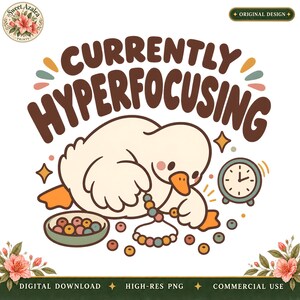 May include: A digital graphic featuring a white duckling with an orange beak, holding a string of colorful beads. The text reads CURRENTLY HYPERFOCUSING in brown letters. Includes a small clock, scattered beads, and floral accents at the corners.