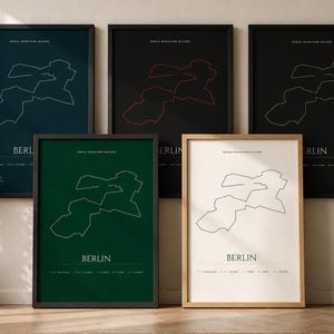 May include: Five framed wall art prints featuring the Berlin marathon route map. Each print displays the course outline, the text 'WORLD MARATHON MAJORS', 'BERLIN', and a list of cities in various color combinations including dark blue, black, green, and white.