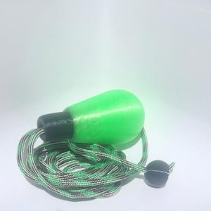 May include: A bright neon green, pear-shaped handle attached to a coiled, green and black patterned cord. The handle features a smooth, matte black cylindrical connector at its base, and the cord includes a small, round black bead stopper.