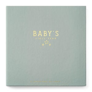May include: A square, sage green fabric-covered memory book with gold foil lettering that reads BABY'S FIRST YEAR, accompanied by three small star icons. At the bottom, the text reads A SIMPLE BOOK OF FIRSTS in smaller gold foil letters.