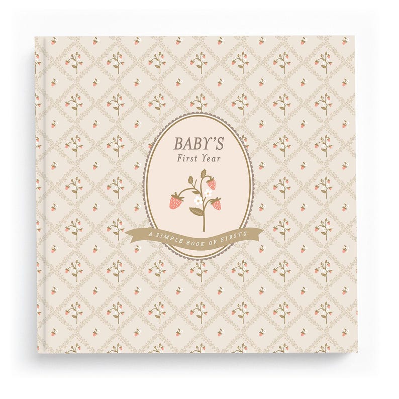 Cottage Garden baby memory book — floral garden first-year journal with a hand-illustrated bloom medallion on a beige ditsy-floral cover.