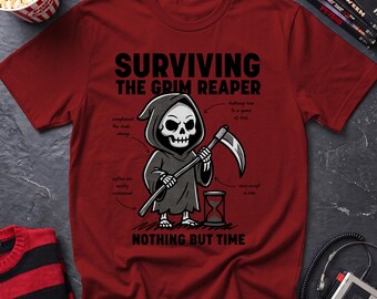 May include: A maroon short-sleeve t-shirt featuring a graphic of a cartoon Grim Reaper holding a scythe next to an hourglass. The text reads SURVIVING THE GRIM REAPER and NOTHING BUT TIME, with smaller handwritten-style notes pointing to the figure.