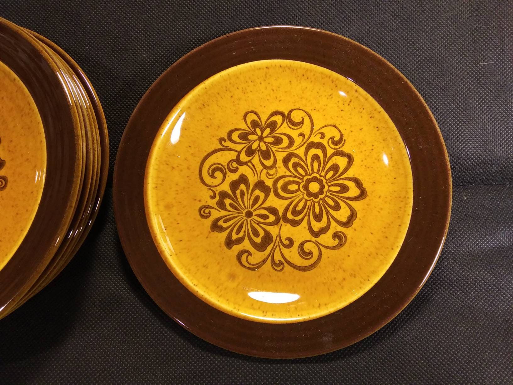 Set of 7 retro "Gold Glade" salad plates designed by Homer Laughlin