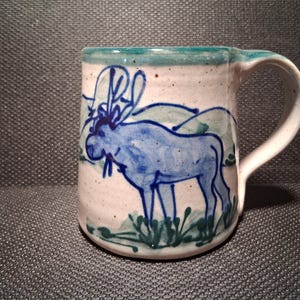 May include: A handmade wooden sign with the text "Welcome to our home" in a handwritten style. The sign is painted white with black lettering and a distressed finish, perfect for farmhouse decor.