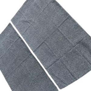 May include: Two gray bath towels with a textured surface. The towels are made of a soft, absorbent material.