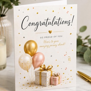 Puede incluir: Una tarjeta de felicitación blanca con el texto Congratulations! SO PROUD OF YOU Here's to your amazing journey ahead! El diseño presenta tres globos en dorado, crema y rosa, junto con dos cajas de regalo con lazos dorados y confeti dorado.