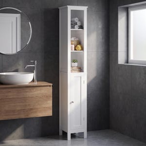 May include: A tall, narrow white bathroom storage cabinet featuring an open upper section with three shelves and a lower section with a single door. The cabinet has a clean, rectangular frame and a small silver knob on the lower door panel.