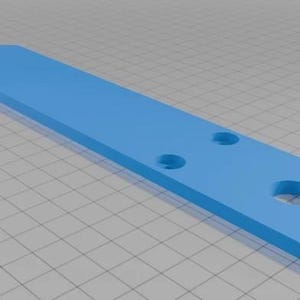May include: A light blue, elongated, flat rectangular component with a pointed end. The object features three circular holes of varying sizes positioned along its length, with two smaller holes near the center and one larger hole near the base.