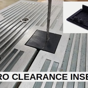 May include: A black zero clearance insert for a bandsaw, featuring a square shape with a central slot for the blade. The insert is shown installed in a metal bandsaw table, with an inset image displaying the component from an angled perspective.