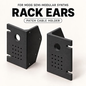 May include: Two black L-shaped rack ears for Moog semi-modular synths, featuring a patch cable holder design. Each piece has a circular hole, a grid of sixteen small holes for cable management, and side mounting slots on a matte black surface.