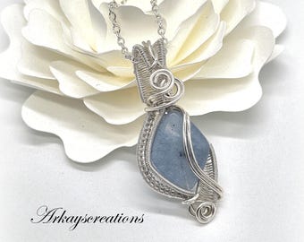 The Serenity Pendant: Artisan Wire-Wrapped Raw Aquamarine in Silver Finish