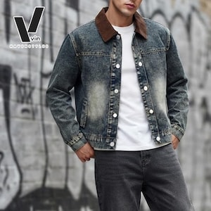May include: A blue acid-wash denim jacket featuring a brown corduroy collar, silver-tone metal buttons, and two chest pockets. The jacket is worn over a plain white t-shirt and dark gray jeans. The logo V vin HAVENSTYLES is visible in the corner.