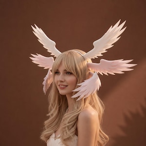 May include: A white headband featuring multiple pairs of stylized, layered wings extending outward from the sides. The wings are smooth, matte, and arranged in a symmetrical pattern, creating a multi-winged effect around the head area.