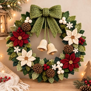 May include: A circular crochet wreath featuring a large olive green bow at the top, two hanging cream-colored bells, red and cream poinsettia flowers with wooden button centers, brown pinecones, white berries, and green leaves.