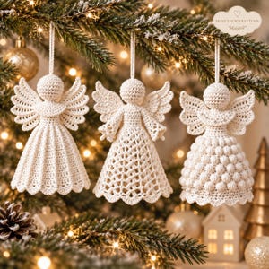 May include: Three off-white crochet angel ornaments hanging from a tree. Each angel features a round head, spread wings, and a unique skirt design: one with vertical pleats, one with a diamond lattice pattern, and one with a textured bobble stitch.
