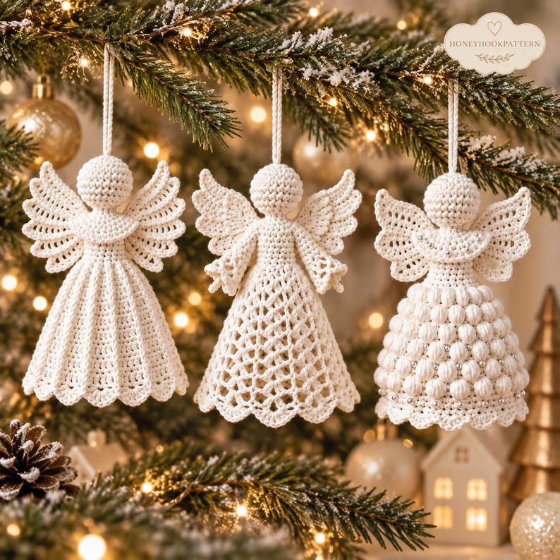 May include: Three off-white crochet angel ornaments hanging from a tree. Each angel features a round head, spread wings, and a unique skirt design: one with vertical pleats, one with a diamond lattice pattern, and one with a textured bobble stitch.
