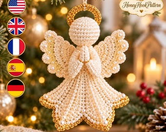 May include: A cream-colored crocheted angel ornament with a gold halo, gold-trimmed wings, and a gold-trimmed dress. The angel has hands clasped in prayer and is decorated with small white pearls. The text HoneyHookPattern is visible.