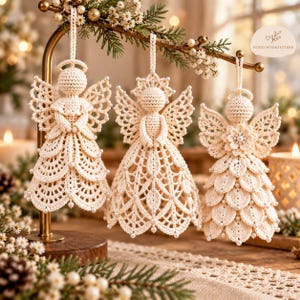 May include: Three off-white crochet angel ornaments hanging from a gold metal stand. Each angel features intricate lace-like stitching, a halo, and small white pearl accents. The text HONEYHOOKPATTERN is visible in the upper right corner.
