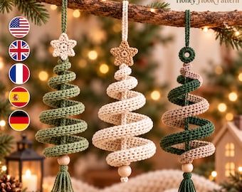 May include: Three hanging crochet Christmas tree ornaments with spiral designs. The left is green with a white star, the center is cream with a tan star, and the right is a mix of green and cream. Each features a wooden bead and a tassel.