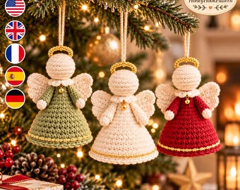 May include: Three crocheted angel ornaments hanging from a tree. Each angel features a cream-colored head, a gold beaded halo, white wings, and a small gold bell at the neck. The dresses are sage green, cream, and red with gold trim.