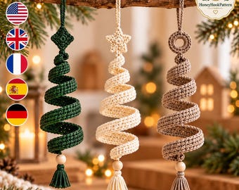 May include: Three spiral-shaped crochet ornaments hanging from a branch. The left is dark green with a diamond top, the center is cream with a star top, and the right is tan with a ring top. Each features a wooden bead and a matching tassel.