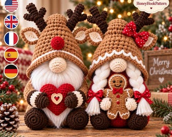 May include: Two crocheted gnome dolls with brown hats, antlers, and white beards. The left gnome holds a red heart with a wooden centre. The right gnome has white braided hair, a red polka-dot bow, and holds a small gingerbread man figure.