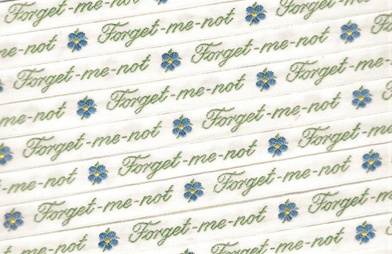 KAFKA A-03/F-02 Jacquard Ribbon Woven Organic Cotton Trim 7/16" wide (10mm) Cream w/Blue & Yellow Forget-Me-Nots, Olive Text, Per Yard