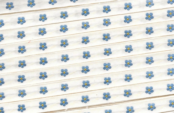 KAFKA A-03/02 Jacquard Ribbon Woven Organic Cotton Trim 7/16" wide (10mm) Ivory Background w/Petite Blue & Yellow Forget-Me-Not Flowers