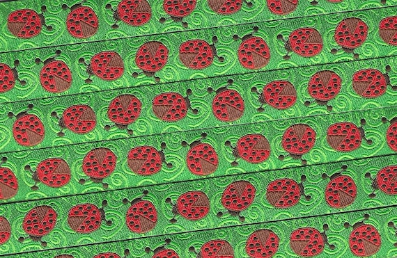 INSECTS C-17-A Jacquard Ribbon Poly Trim 5/8" wide (16mm) Green Swirl Background w/Red Ladybugs