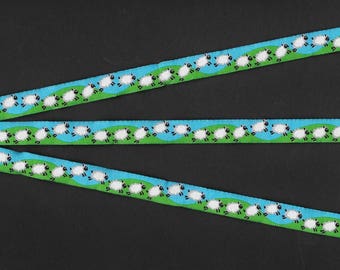 ANIMALS/Farm A-02-A Jacquard Ribbon Poly Trim 7/16" wide (10mm) Turquoise w/Green Grass, Running/Jumping Black & White Sheep