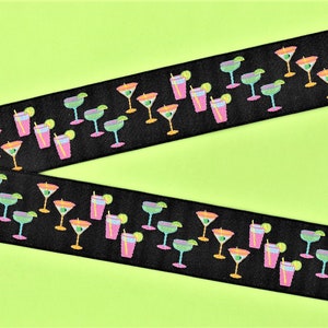 May include: Black ribbon with a repeating pattern of colorful cocktail glasses and lime slices. The ribbon is perfect for adding a festive touch to any project.