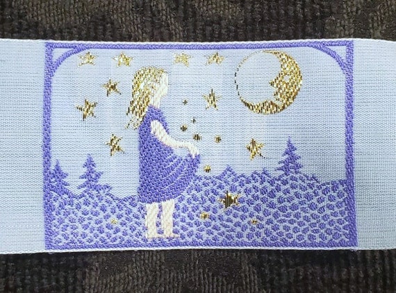 KAFKA H-09/05 Jacquard Ribbon Woven Organic Cotton Trim 1-5/8" wide (42mm) "Starcatcher" Girl w/Apron, Lilac Blue w/Gold Metallic Stars Moon