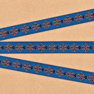 May include: Three blue ribbon trims with a repeating geometric pattern in red, black, and white.