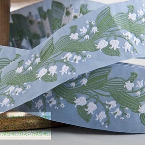 KAFKA H-02/03 Jacquard Ribbon Woven Organic Cotton Trim 1-1/2" wide (38mm) Lt Blue Background White Lilies of the Valley, Green Leaves/Stems