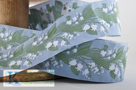 KAFKA H-02/03 Jacquard Ribbon Woven Organic Cotton Trim 1-1/2" wide (38mm) White Lilies of the Valley on Lt Blue w/Green Leaves