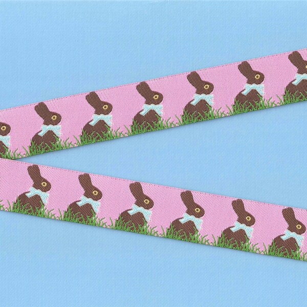 ANIMAUX/Farm E-01-A Ruban jacquard bordure en poly 7/8" de large (22 mm) Pâques fond rose avec lapins en chocolat, noeuds bleus