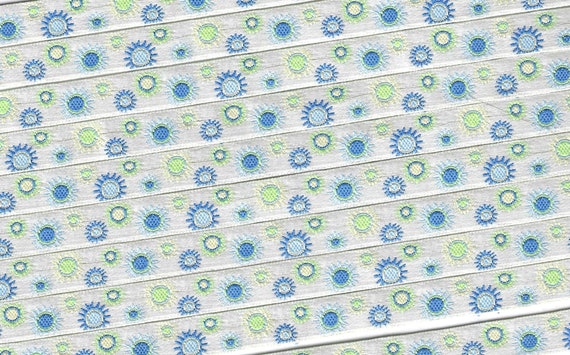 GEOMETRIC A-09-C Jacquard Ribbon Polyester Trim 3/8" wide (9mm) Ivory Background w/Royal Blue, Lt Blue, Cream & Lime "Sunbursts"