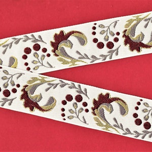 May include: White fabric trim with a repeating pattern of burgundy, gold, and gray floral designs. The trim features a stylized floral motif with berries.