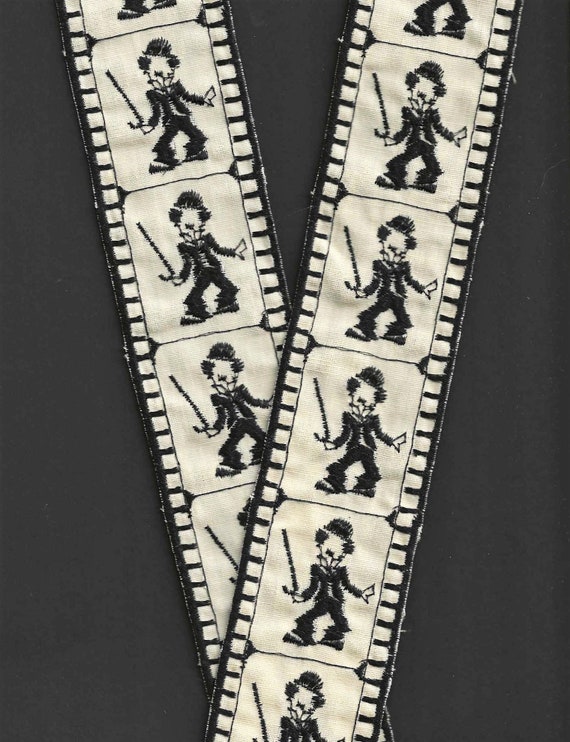 VINTAGE NOVELTY L-23-B Embroidered Cotton Trim, 2-1/8" Wide (54mm) Unique Charlie Chaplin "Film Clip" in Beige w/Black Thread, Per Yard