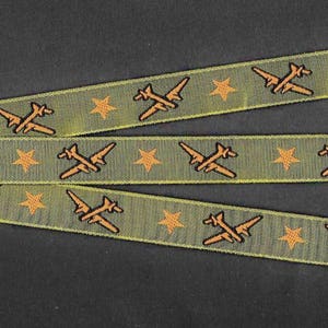 NOVELTY/PLANES C-01-A Jacquard Ribbon Poly Trim, 5/8 Wide 16mm Olive Green w/Carmel Brown Airplanes & Stars, Black Accents, Per Yard image 1