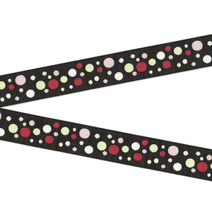 May include: Black ribbon with a repeating pattern of colorful polka dots in red, white, light green, and pink. The ribbon is angled across a white background, showcasing its decorative design.