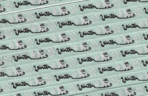 KAFKA A-18/01 Jacquard Ribbon Woven Organic Cotton Trim 7/16" wide (10mm) Mint Green Background w/White Ice Skates and Black "WINTER" Words