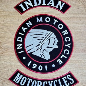 May include: A set of three embroidered patches featuring the Indian Motorcycle logo. The central circular patch displays a profile of a person in a headdress with the text Indian Motorcycle 1901. Two curved rocker patches read Indian and Motorcycles.